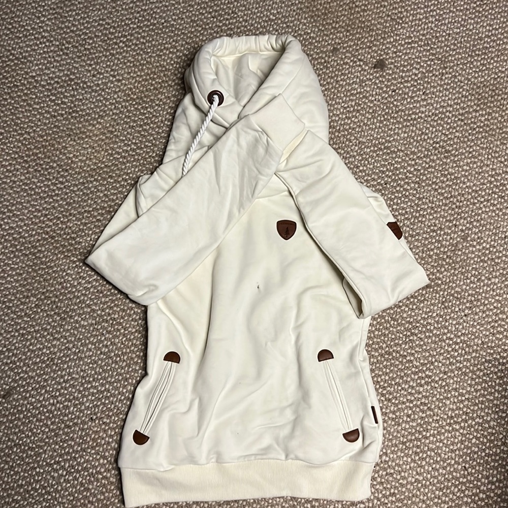 It’s very durable and cream with a hood